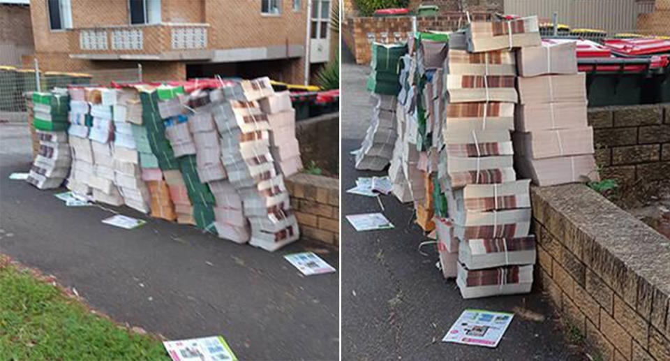 Piles of catalogues line the footpath outside a Sydney apartment block.