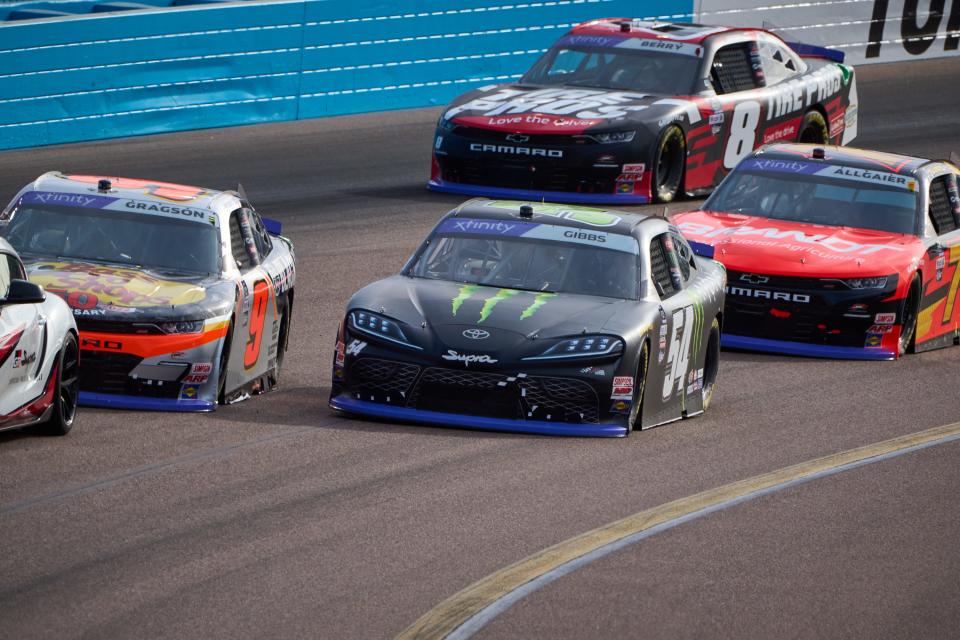 Nov 5, 2022; Avondale, AZ, USA; NASCAR Xfinity Series driver Noah Gragson (9)  and Ty Gibbs (54) inch ahead of one another while waiting for the pace car to enter the pits and let the NASCAR Xfinity Series championship race begin at Phoenix International Raceway in Avondale on Saturday, Nov. 5, 2022. Mandatory Credit: Alex Gould/The Republic