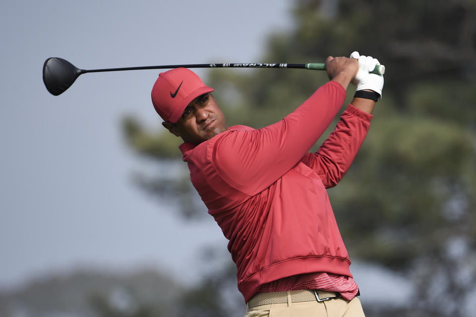 Tony Finau hits his tee shot on the fifth hole of the South Course at Torrey Pines Golf Course during the third round of the Farmers Insurance golf tournament Saturday, Jan. 25, 2020, in San Diego. (AP Photo/Denis Poroy)