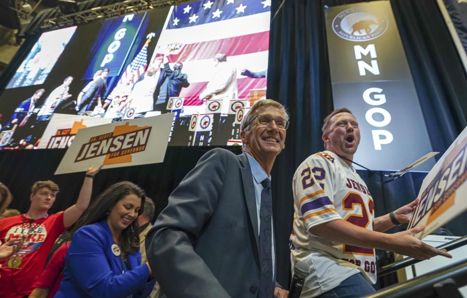 FILE - In this May 14, 2022, file photo, Minnesota GOP gubernatorial candidate Dr. Scott Jensen, center, takes the stage after winning the party's endorsement for governor, at the Minnesota State Republican Convention in Rochester, Minn. (Glen Stubbe/Star Tribune via AP, file)