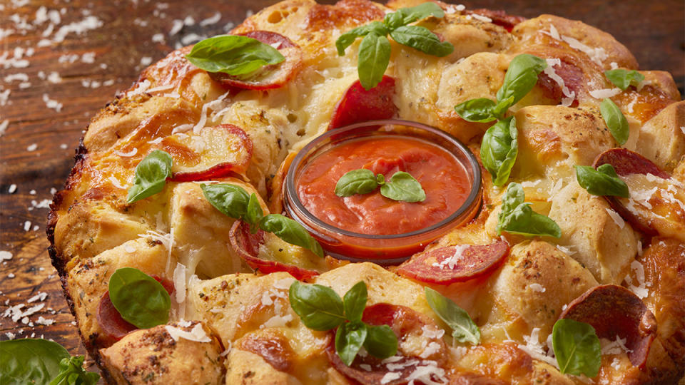 Pepperoni pizza pull apart monkey bread as one of the recipes for a game day snacks spread