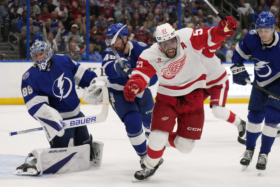 Detroit Red Wings left wing David Perron (57) celebrates after scoring past Tampa Bay Lightning goaltender Andrei Vasilevskiy (88) during the third period of an NHL hockey game Monday, April 1, 2024, in Tampa, Fla. (AP Photo/Chris O'Meara)