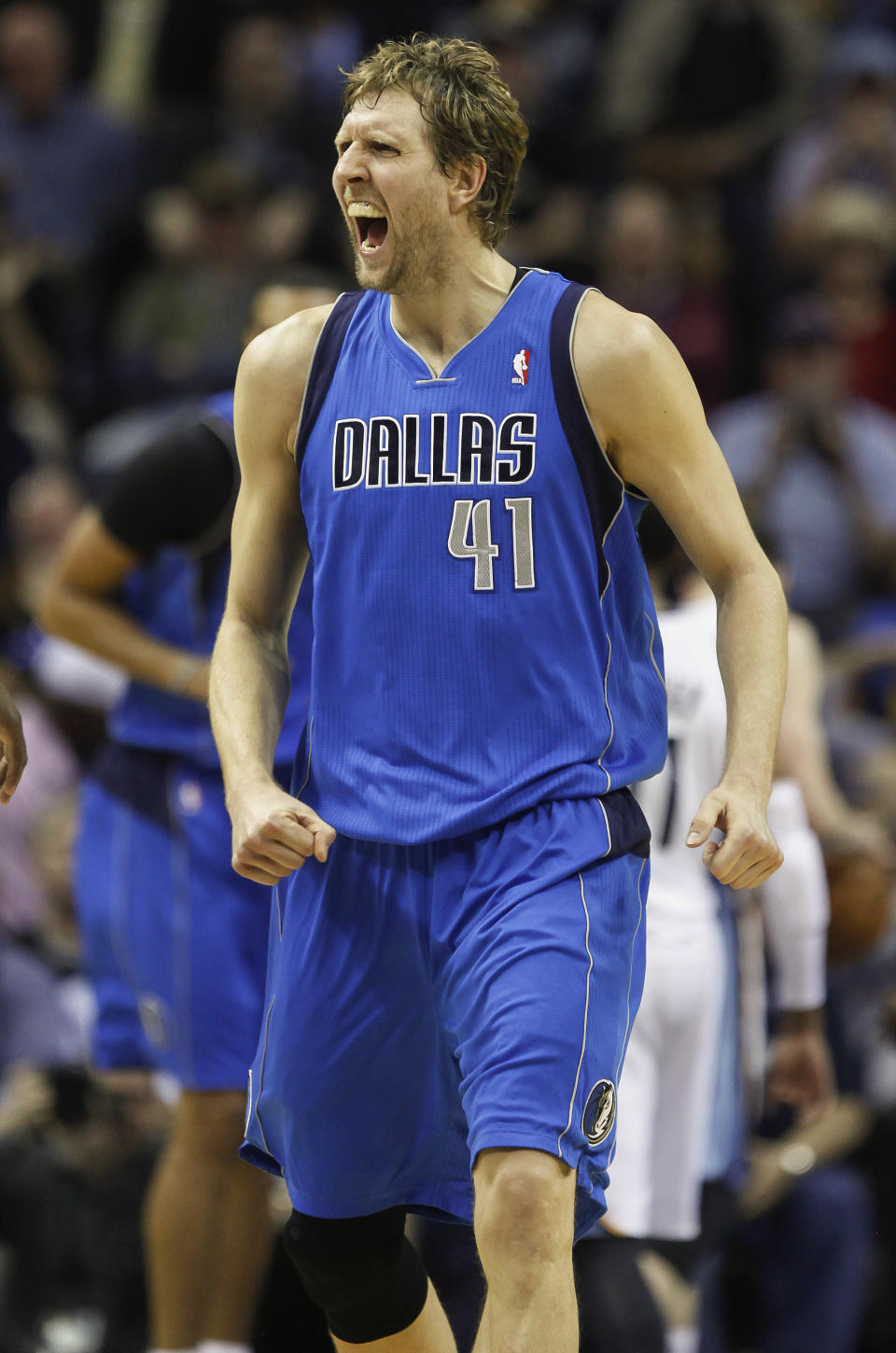 Dallas Mavericks forward Dirk Nowitzki (41), of Germany, cries out after scoring against the Memphis Grizzlies in the second half of an NBA basketball game Wednesday, April 16, 2014, in Memphis, Tenn. The Grizzlies won in overtime 106-105. (AP Photo/Lance Murphey)