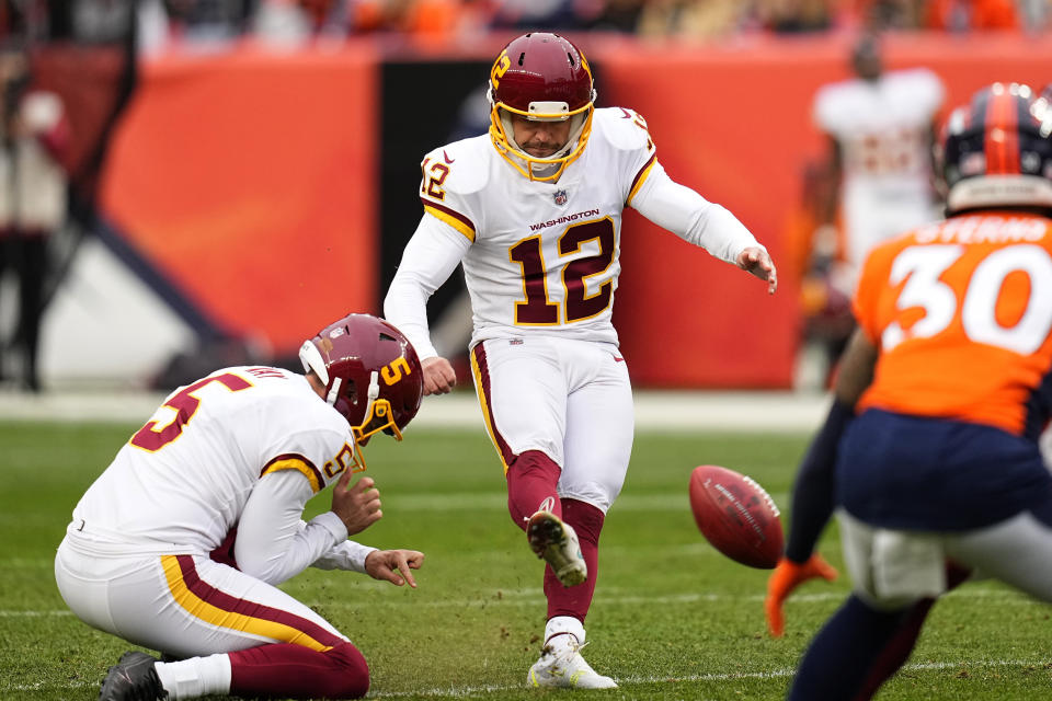 Washington Football Team kicker Chris Blewitt (12) attempts a field goal against the Denver Broncos during the first half of an NFL football game, Sunday, Oct. 31, 2021, in Denver. The Broncos blocked the kick and recovered the ball. (AP Photo/Jack Dempsey)