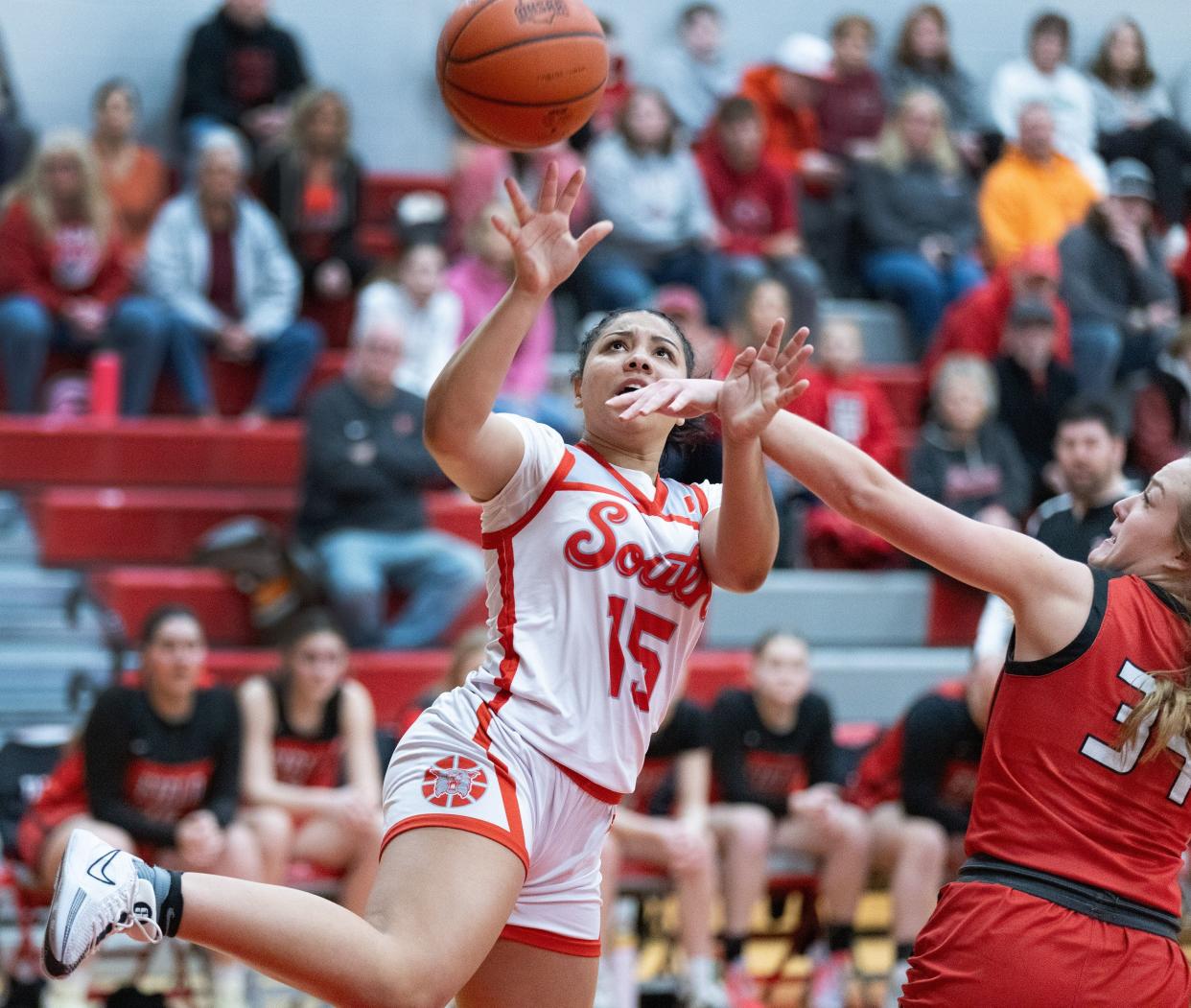 Canton South’s Summer Hastings-Peterson is fouled by Field’s Ally Harlin on Saturday, Feb. 24, 2024.