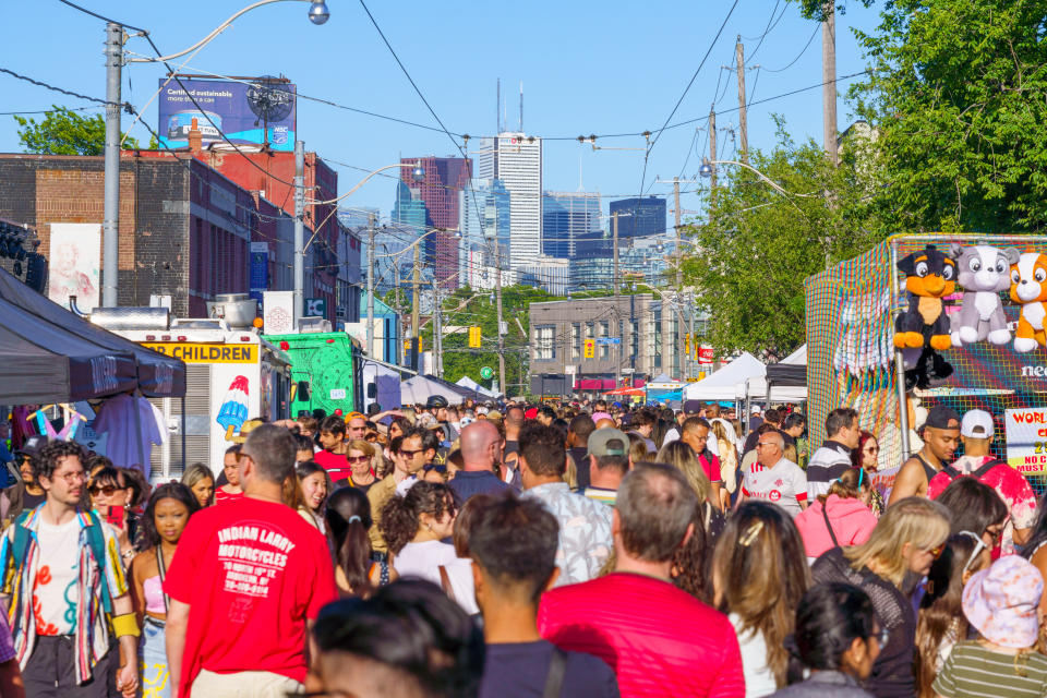 TORONTO, ONTARIO, CANADA - 2022/06/04: Crowd of people on a Toronto street. (Photo by Roberto Machado Noa/LightRocket via Getty Images)