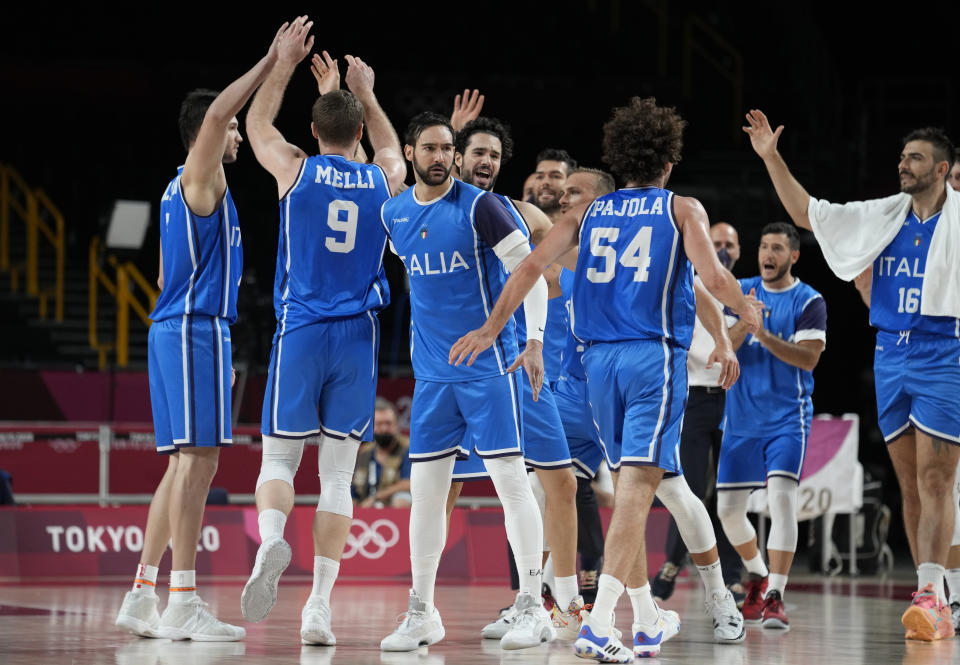 Italy players celebrate during men's basketball preliminary round game at the 2020 Summer Olympics, Sunday, July 25, 2021, in Saitama, Japan. (AP Photo/Eric Gay)