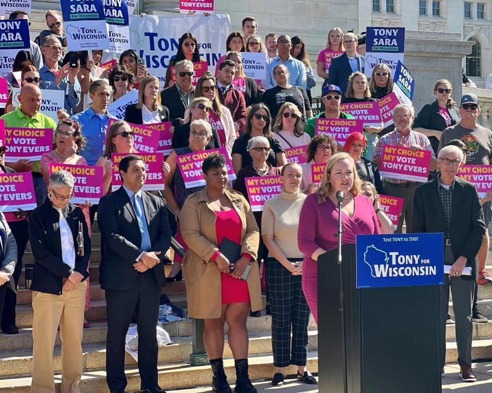 Democrats gather on the steps of the Wisconsin State Capitol on Oct. 4 to rally for overturning the state's abortion ban. Speaking is state Sen. Kelda Roys, D-Madison.