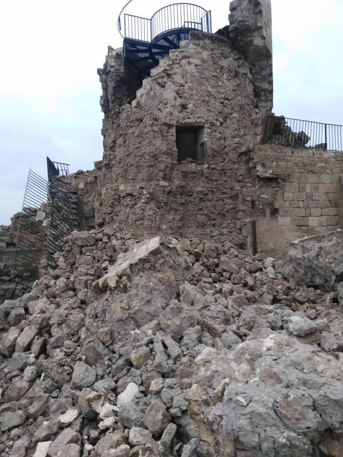 A partially collapsed tower with its internal structure exposed