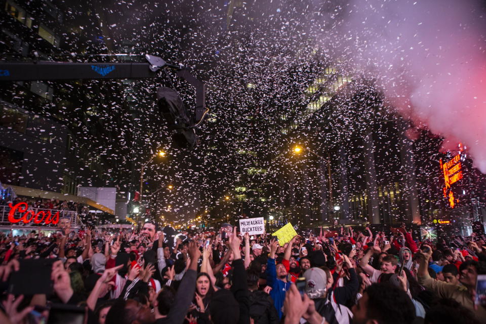 Toronto Raptors fans react after the team's 100-94 win over the Milwaukee Bucks in Game 6 of the NBA basketball playoffs Eastern Conference finals, outside Scotiabank Arena on Saturday, May 25, 2019, in Toronto. (Chris Young/The Canadian Press via AP)