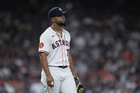 Houston Astros first baseman Jose Abreu reacts after committing a fielding error that allowed a run to score during the third inning of the team's baseball game against the New York Yankees, Saturday, March 30, 2024, in Houston. (AP Photo/Kevin M. Cox)