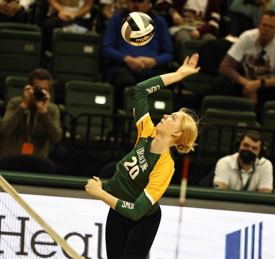 Ursuline Academy's Lindy Radaszewski (20) goes up for a kill attempt during their state semifinal against Bishop Watterson Friday, Nov. 11, 2022.