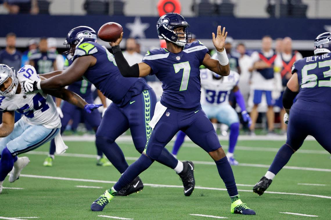 Seattle Seahawks quarterback Geno Smith (7) throws a pass in the first half of a preseason NFL football game against the Seattle Seahawks in Arlington, Texas, Friday, Aug. 26, 2022. (AP Photo/Ron Jenkins)