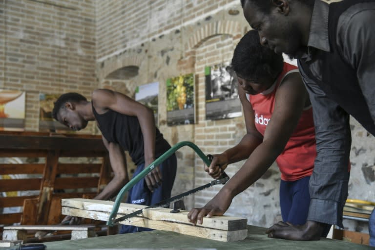 Migrants from African countries attend a lesson of carpentry in Sant' Alessio in Aspromonte, a small village of 330 inhabitants in Calabria, southern Italy