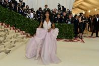 <p>Singer SZA made the night her own in this Versace lavender gown with matching thigh-high boots. Photo: Getty Images </p>