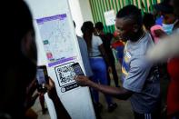 Migrants wait as they hope to obtain humanitarian visas to transit Mexican territory, in Tapachula