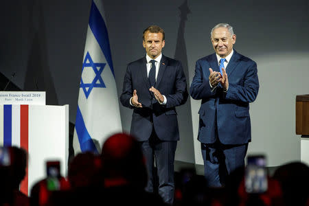 French President Emmanuel Macron and Israeli Prime Minister Benjamin Netanyahu attend the opening ceremony of the France-Israel season event in Paris, France, June 5, 2018. Christophe Petit Tesson/Pool via Reuters.