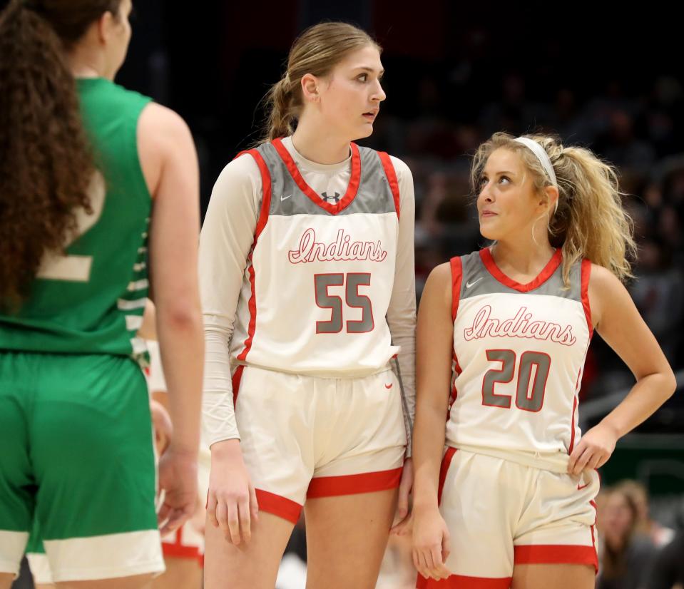 Northwest's Lily Bottomley (left) talks to teammate Gwen Lower during a break in Thursday's OHSAA Division II state semifinal against Proctorville Fairland.