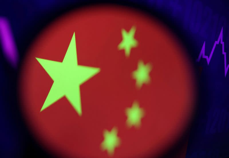 FILE PHOTO: Illustration picture shows Chinese flag and stock graph