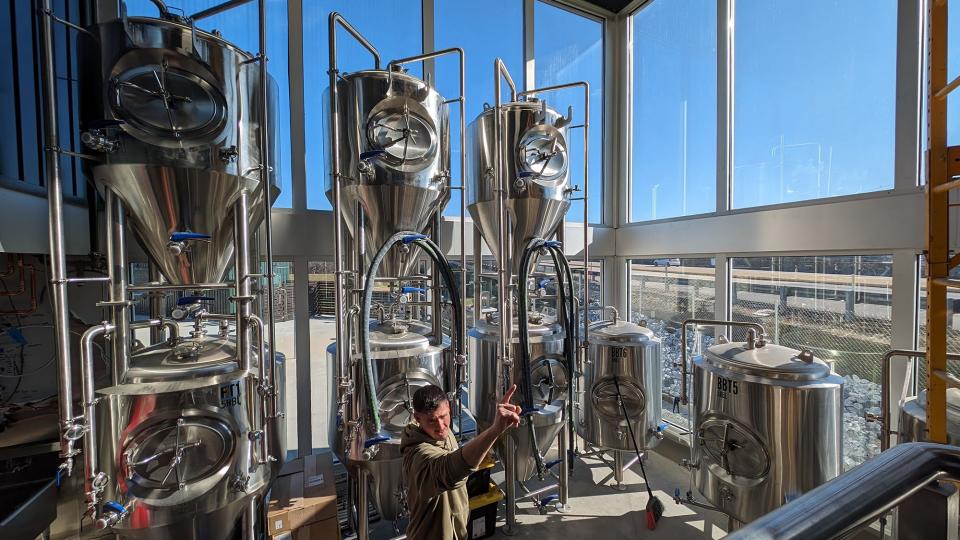 Brewmaster Justin Lee, a former brewer for Victory Brewing, gives a tour of the brewery integrated into Spruce on Blackbridge. The tanks are highly visible through the tall windows when traveling Route 30 westbound.