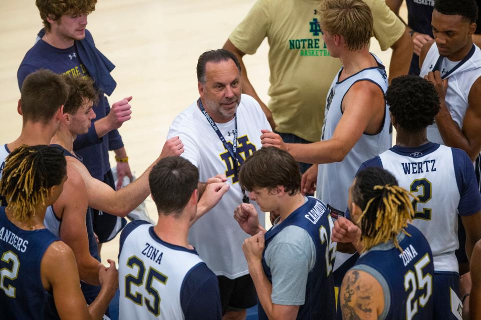 Notre Dame head coach Mike Brey circles up with players during practice Tuesday, July 19, 2022 at the Rolfs Athletics Hall in South Bend. 