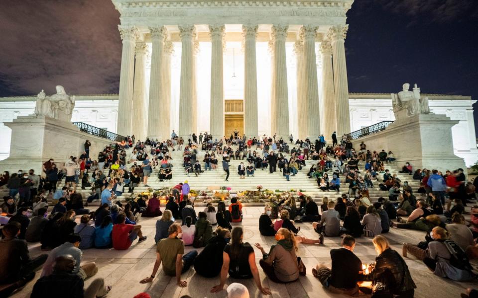 Mourners gather outside the US Supreme Court after Justice Ruth Bader Ginsburg died  - JIM LO SCALZO/EPA-EFE/Shutterstock