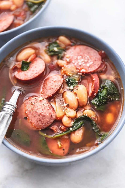 <p>Le Creme de La Crumb</p><p>Sausage and white bean soup is an easy and deliciously filling combination of cannellini beans, onions, garlic, roasted tomatoes, kielbasa, and lots of Italian herbs and spices that bring it all together.</p><p><strong>Get the recipe: <a href="https://www.lecremedelacrumb.com/sausage-and-white-bean-soup/" rel="nofollow noopener" target="_blank" data-ylk="slk:Sausage and White Bean Soup;elm:context_link;itc:0;sec:content-canvas" class="link rapid-noclick-resp"><em>Sausage and White Bean Soup</em></a></strong></p>