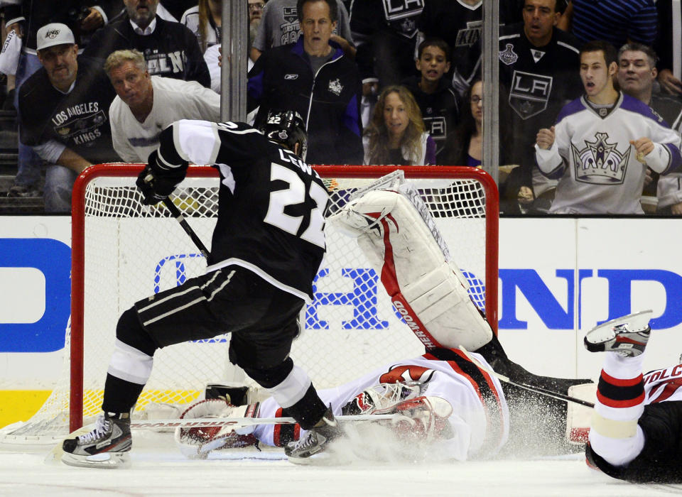 FILE - In this June 6, 2012, file photo, New Jersey Devils goalie Martin Brodeur (30) stops a shot on the goal by Los Angeles Kings center Trevor Lewis (22) during the third period of Game 4 of the NHL hockey Stanley Cup finals in Los Angeles. The Winnipeg Jets are showing early signs of following the pattern of the 2012 Stanley Cup champion Kings. Lewis is the one common player who was on both teams. (AP Photo/Mark J. Terrill, File)