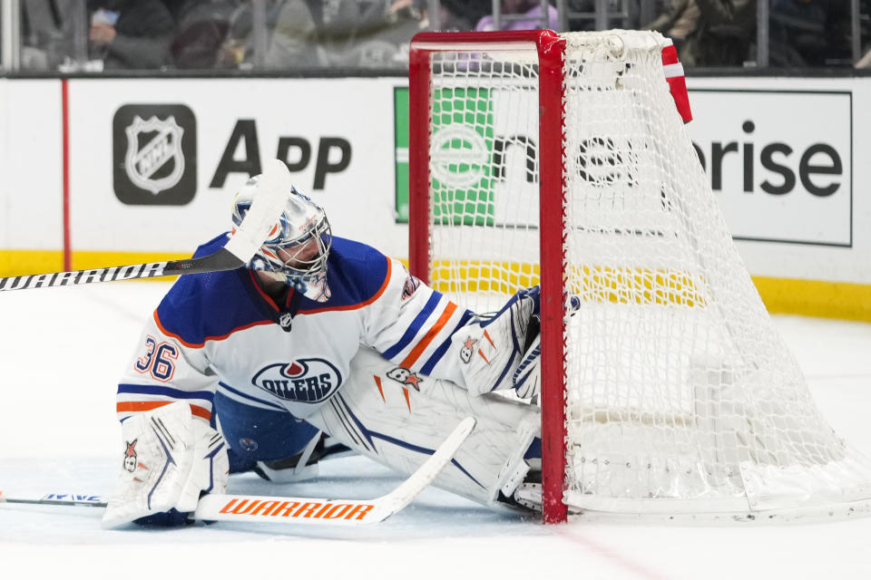 Edmonton Oilers goaltender Jack Campbell (36) catches the puck hit by Los Angeles Kings' Adrian Kempe during the second period of an NHL hockey game Monday, Jan. 9, 2023, in Los Angeles. The play was ruled a goal after a video review. (AP Photo/Jae C. Hong)