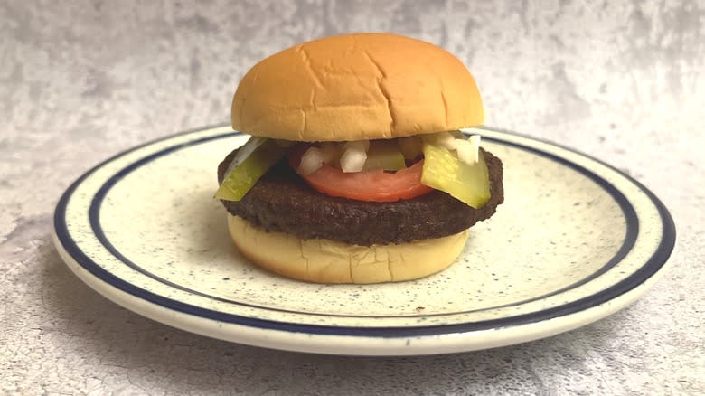 dressed burger on a plate