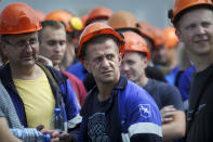 Workers of the Grodno Azot Plant listen to a speaker during a strike in Grodno, 246 kilometers (154 miles) west of Minsk, Belarus, Wednesday, Aug. 19, 2020. The authoritarian leader of Belarus complained that encouragement from abroad has fueled daily protests demanding his resignation as European Union leaders held an emergency summit Wednesday on the country's contested presidential election and fierce crackdown on demonstrators. (AP Photo/Viktor Drachev)