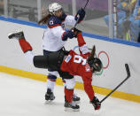 Anne Schleper of the United States (15) collides with Rebecca Johnston of Canada (6) during the second period of the women's gold medal ice hockey game at the 2014 Winter Olympics, Thursday, Feb. 20, 2014, in Sochi, Russia. (AP Photo/Petr David Josek)