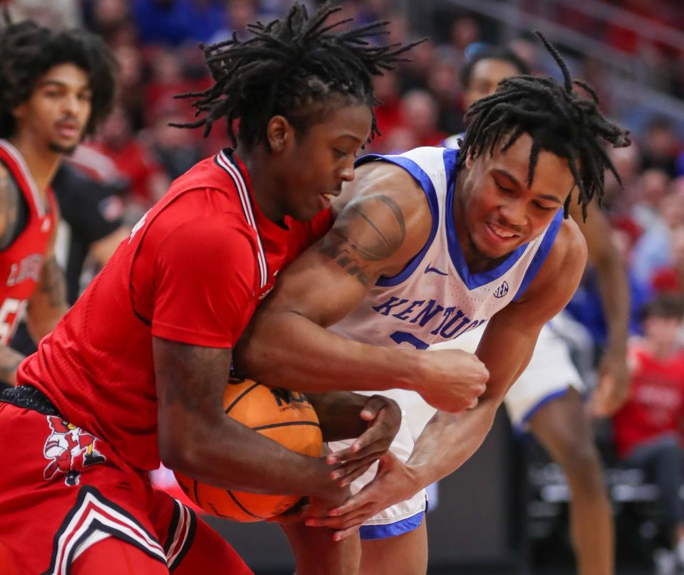 Louisville’s Ty-Laur Johnson steals the ball from Kentucky’s D.J. Wagner in the first half at the KFC Yum! Center on Thursday.