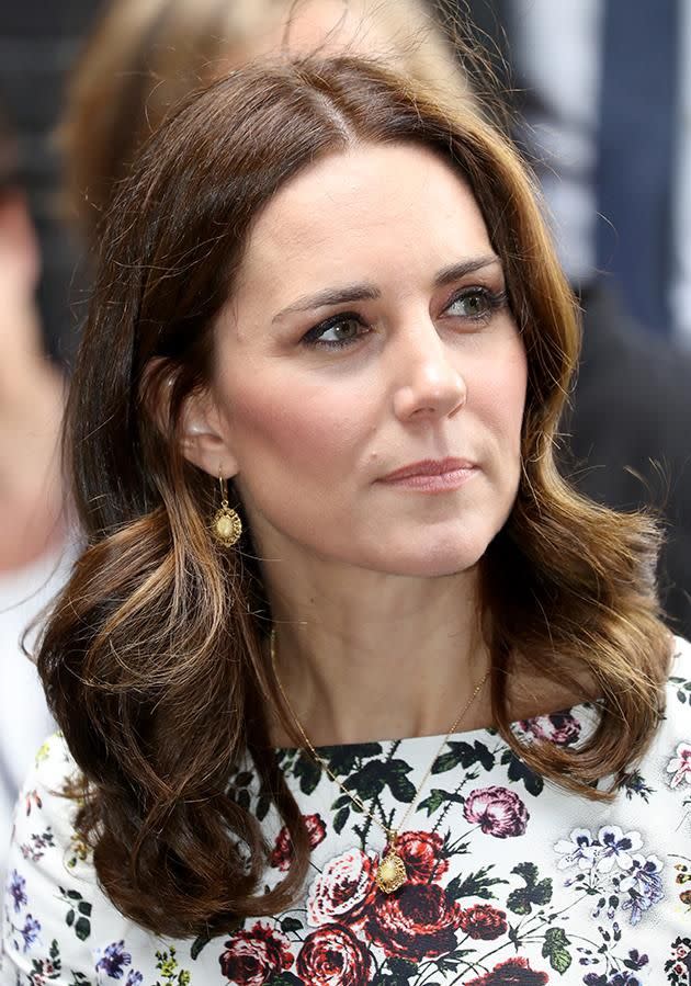 Kate looked sombre as she made her way around the camp. Photo: Getty Images