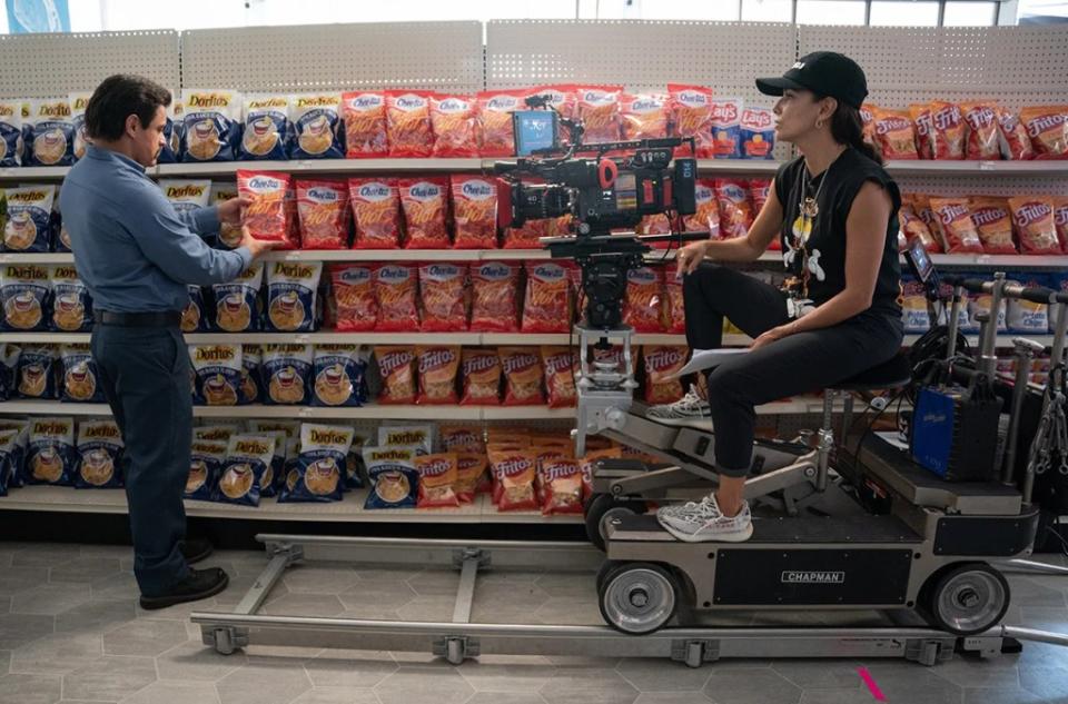 Jesse Garcia and Eva Longoria on the set of “Flamin’ Hot,” Longoria’s feature directing debut. (Photo by Emily Aragones / Searchlight Pictures)