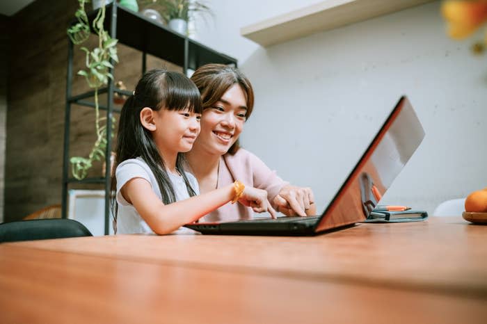 mother and daughter on the computer