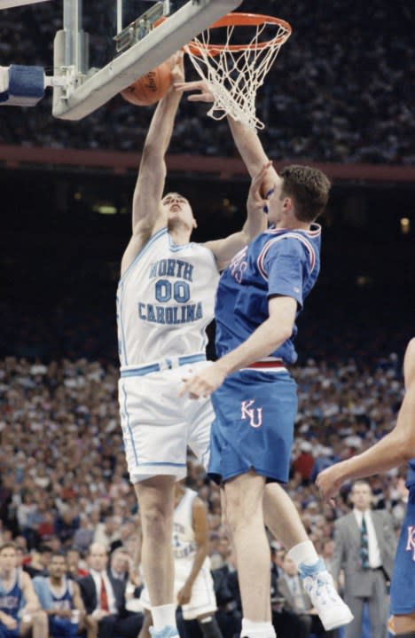 North Carolinas center Eric Montross (00) has his shot blocked by Kansas center Eric Pauley (51) during the first half of their semi-final game of the Final Four at the Superdome, Saturday, April 3, 1993, New Orleans, La. (AP Photo/Ed Reinke)