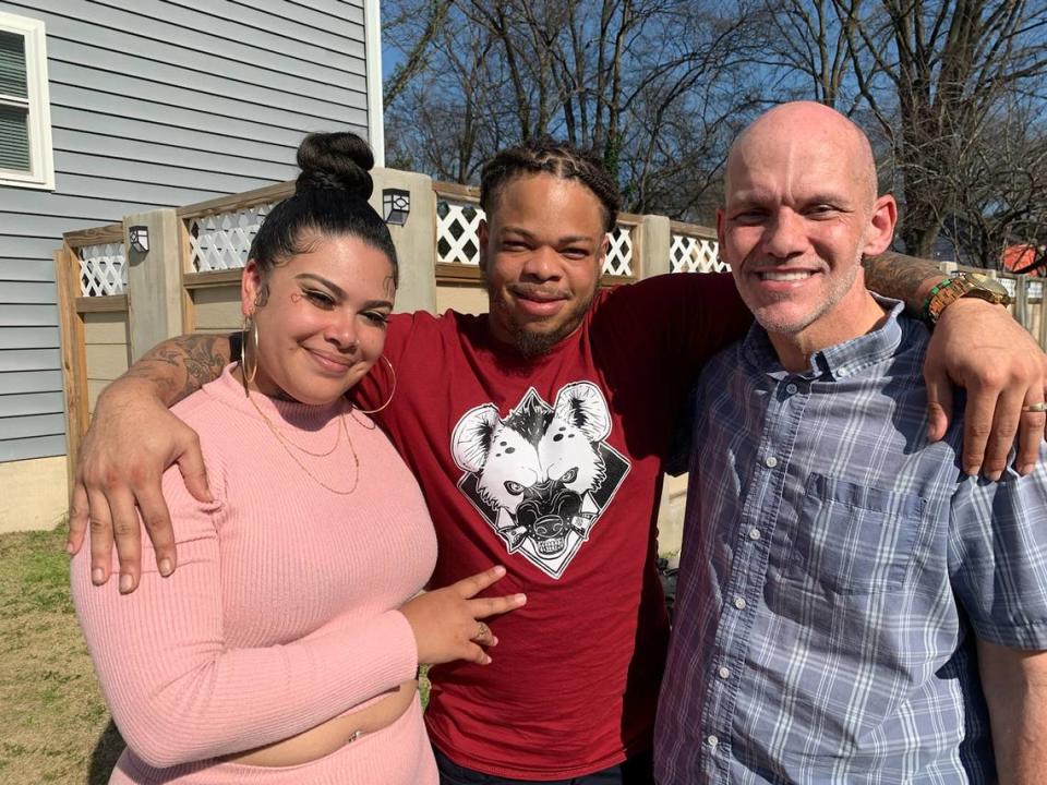 Tyrece Woods and his wife Liz reunited with his cousin, George Burrell, during a 2022 visit to Charlotte. Woods’ mother, Brandi Henderson, was murdered by serial killer Henry Louis Wallace in March 1994.