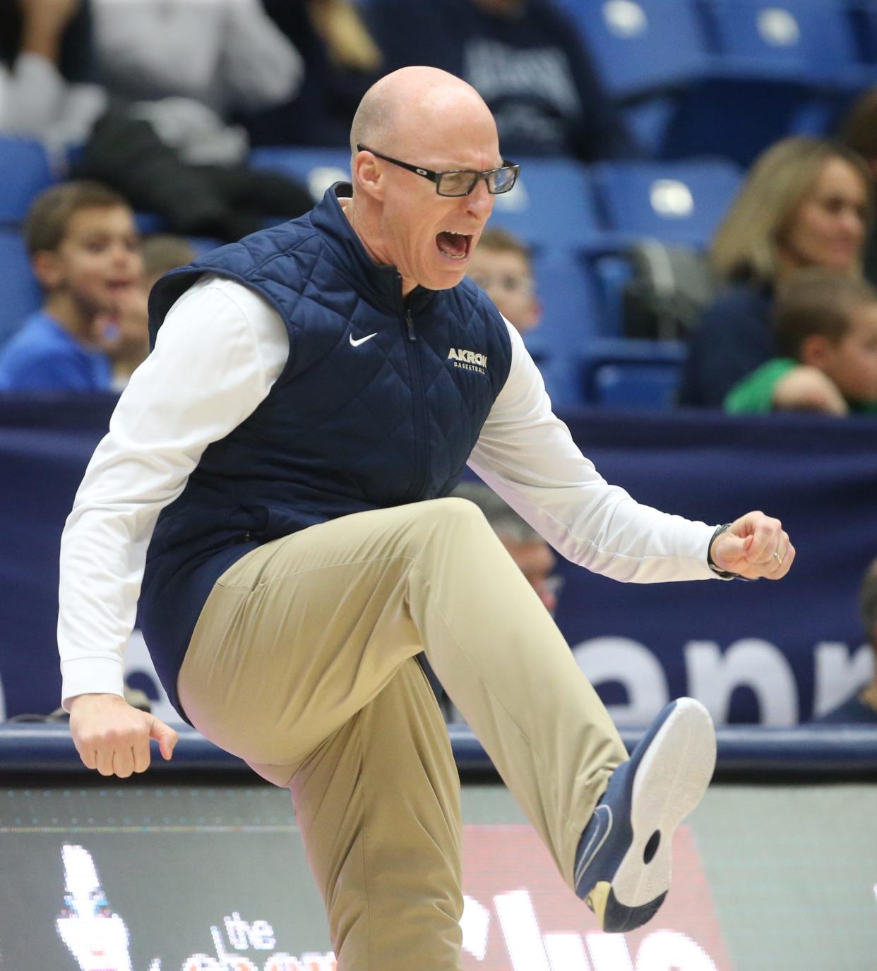 An animated University of Akron head coach John Groce during the second half of the Zips' 94-90 overtime win against Gardner-Webb on Thursday, Dec. 21, 2023, in Akron, Ohio. [Phil Masturzo/ Beacon Journal]