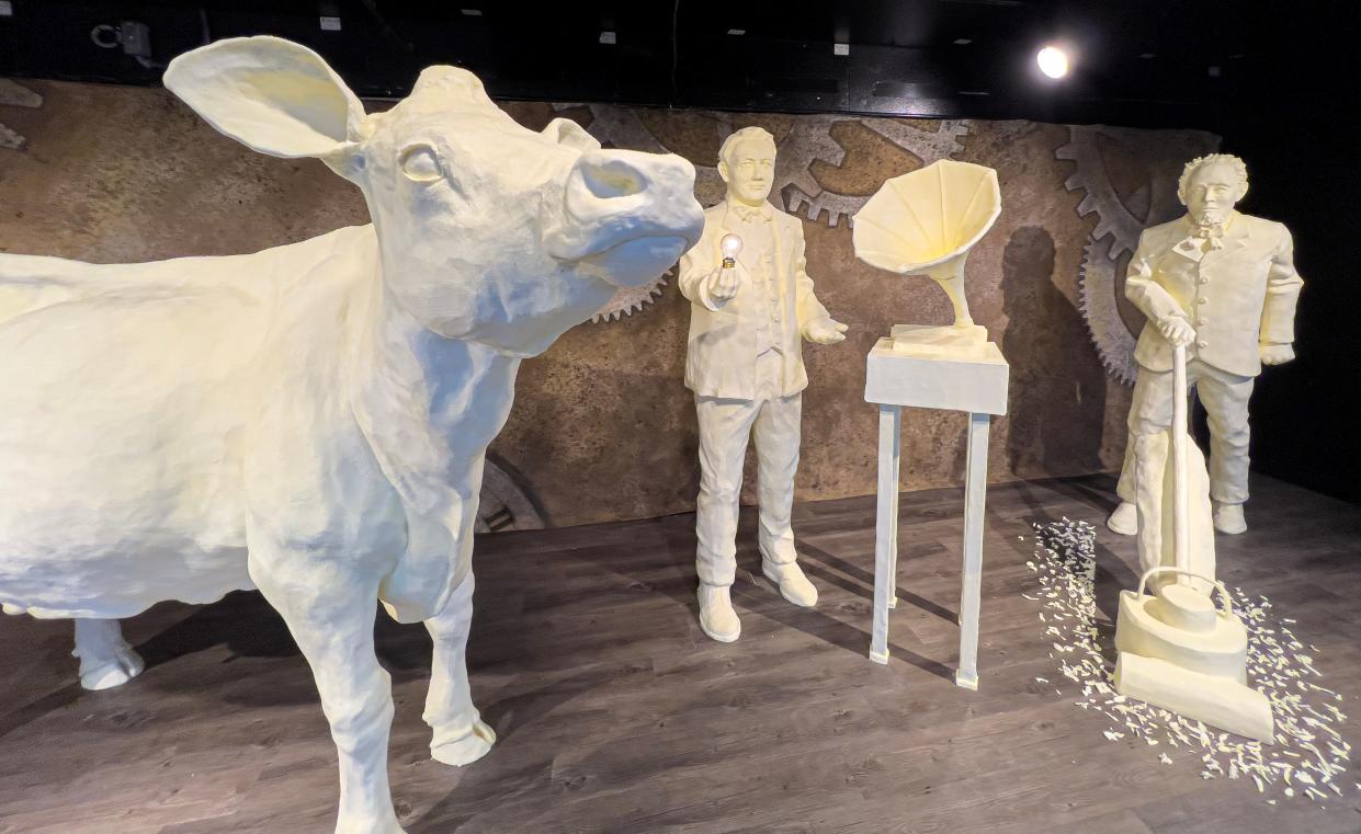 About 2,000 pounds of butter were used to create 2023's butter cow display at the Ohio State Fair, which featured Ohio inventors such as Thomas Edison and James Spangler.