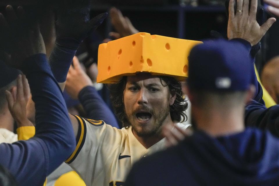 Milwaukee Brewers' Brian Anderson reacts in the dugout after hitting a two-run home run during the eighth inning of a baseball game against the New York Mets Tuesday, April 4, 2023, in Milwaukee. (AP Photo/Morry Gash)