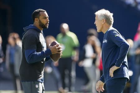 Sep 23, 2018; Seattle, WA, USA; Seattle Seahawks head coach Pete Carroll, right, talks with wide receiver Doug Baldwin (89) during pregame warmups against the Dallas Cowboys at CenturyLink Field. Mandatory Credit: Joe Nicholson-USA TODAY Sports