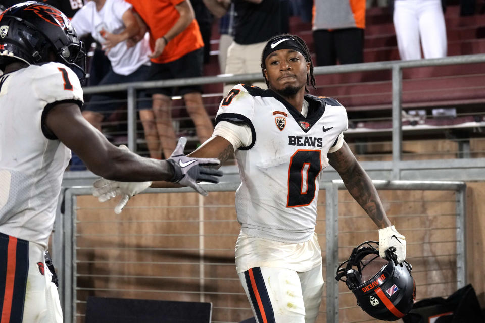 Oregon State Beavers wide receiver Tre'Shaun Harrison (0) celebrates with wide receiver Tyjon Lindsey (1) after scoring a touchdown against the Stanford Cardinal during the fourth quarter at Stanford Stadium Oct. 8, 2022, in Stanford, California.