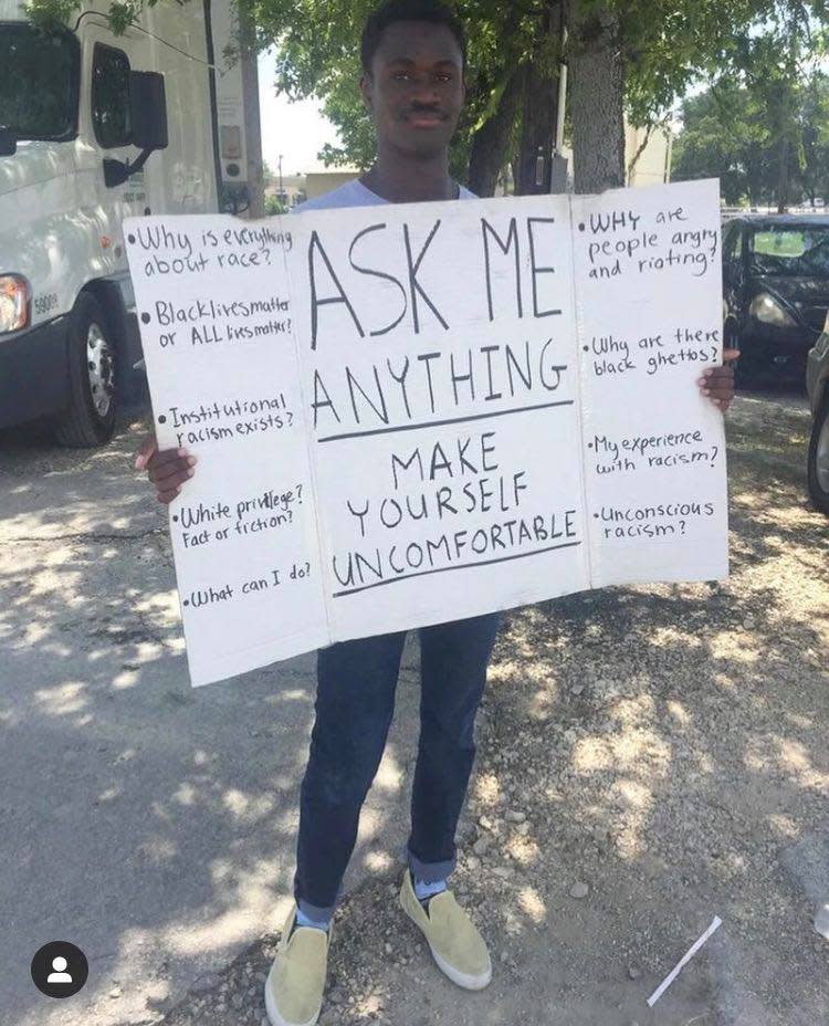 Nisa Kaniga is inviting passersby in Dripping Springs, Texas to discuss their pressing questions about race with him. (Photo: Courtesy of Nisa Kaniga)