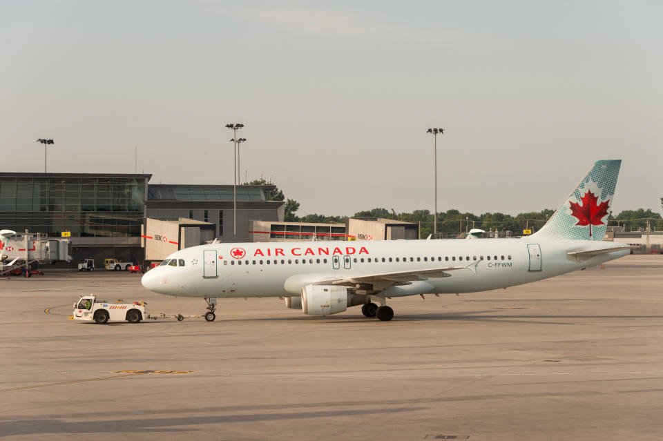 Montreal, CA - 17 August 2017: Air Canada commercial planes on the tarmac of Montreal Pierre Elliott Trudeau International Airport