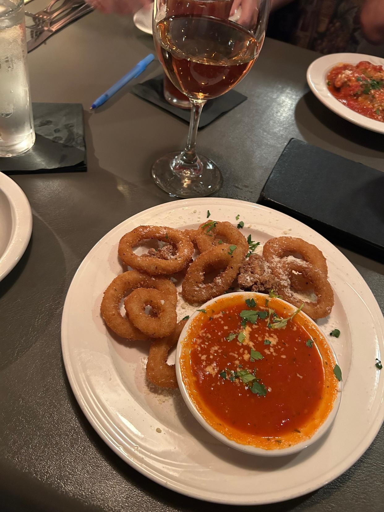 Lightly breaded calamari rings are served with marinara sauce at Santosuosso's in Medina Township.