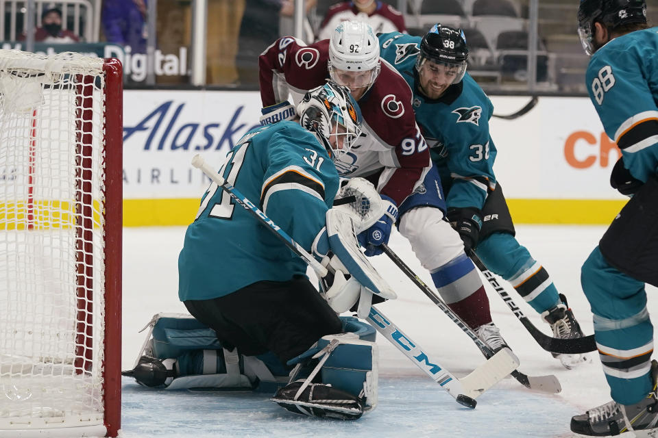 San Jose Sharks goaltender Martin Jones (31) defends on a shot by Colorado Avalanche left wing Gabriel Landeskog (92) during the second period of an NHL hockey game in San Jose, Calif., Wednesday, March 3, 2021. (AP Photo/Jeff Chiu)