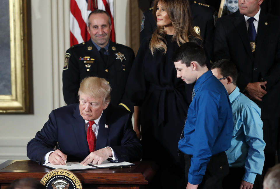 The president signs a memorandum declaring the opioid crisis a public health emergency. (Photo: Pablo Martinez Monsivais/AP)