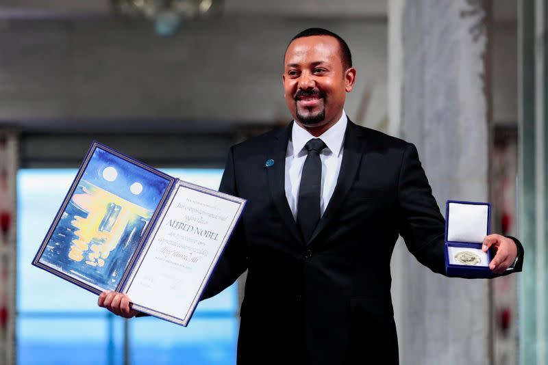 FILE PHOTO: Ethiopian Prime Minister Abiy Ahmed Ali poses with medal and diploma after receiving Nobel Peace Prize during ceremony in Oslo City Hall