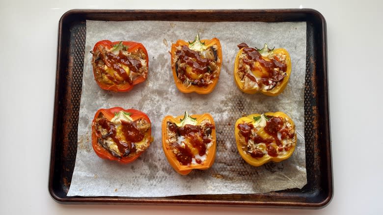 korean stuffed bell peppers with egg and gochujang on baking sheet